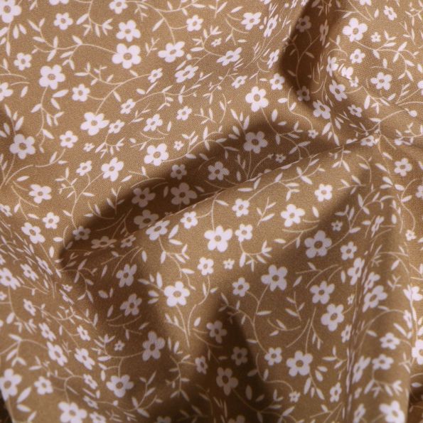 Tissu Popeline Coton Bio Petites fleurs blanches sur fond Beige - Par 10 cm