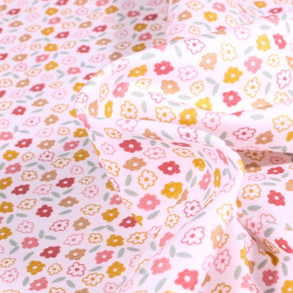 Tissus Jersey Coton Pâquerettes colorés sur fond Blanc - Par 10 cm