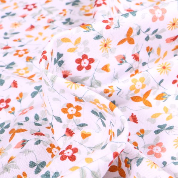 Tissu Jersey Coton Petites fleurs colorés sur fond Blanc - Par 10 cm