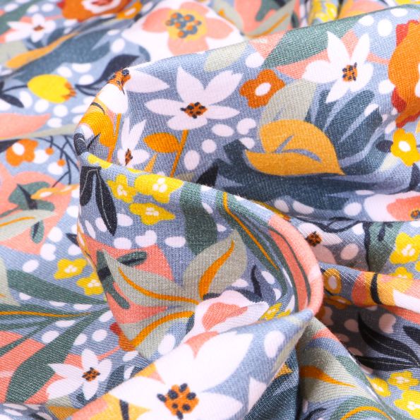 Tissu Jersey Coton Fleurs exotiques sur fond Bleu - Par 10 cm