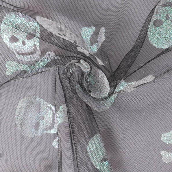Tissu Tulle souple  Morgana tête de mort paillettes argentés et irisés sur fond Noir - Par 10 cm