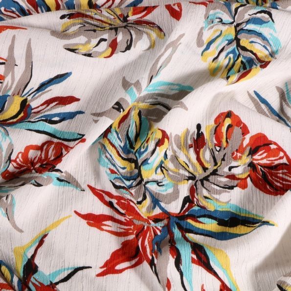 Tissu Crépon Viscose Feuilles de monstera colorées rayures lurex sur fond Blanc - Par 10 cm