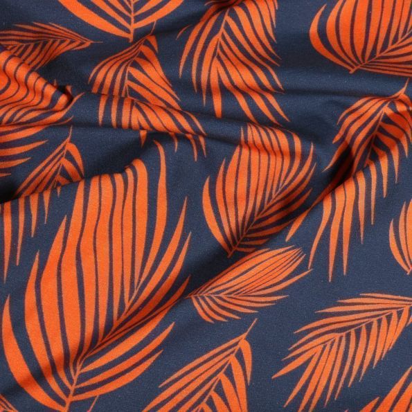 Tissu Jersey Coton Feuilles de palme sur fond Bleu - Par 10 cm