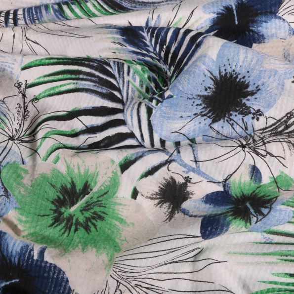 Tissu Seersucker Polyviscose Fleurs bleues et vertes sur fond Blanc - Par 10 cm