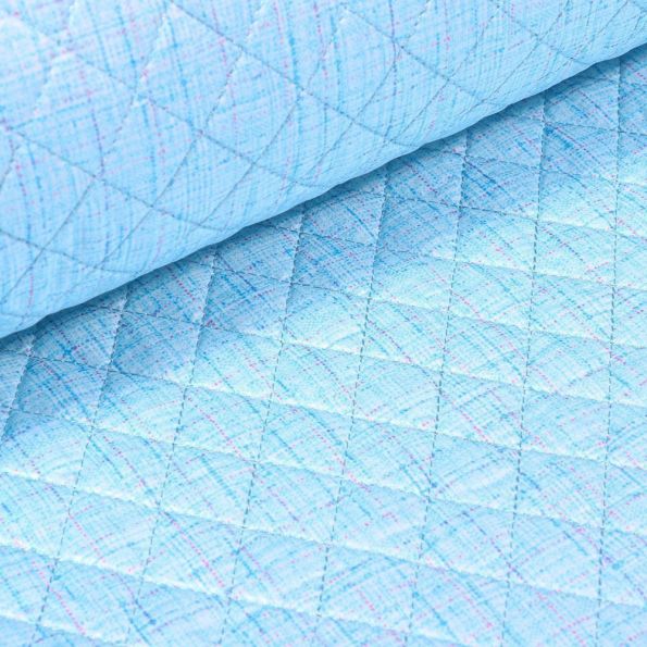 Tissu Doudoune matelassé London Chiné sur fond Bleu - Par 10 cm