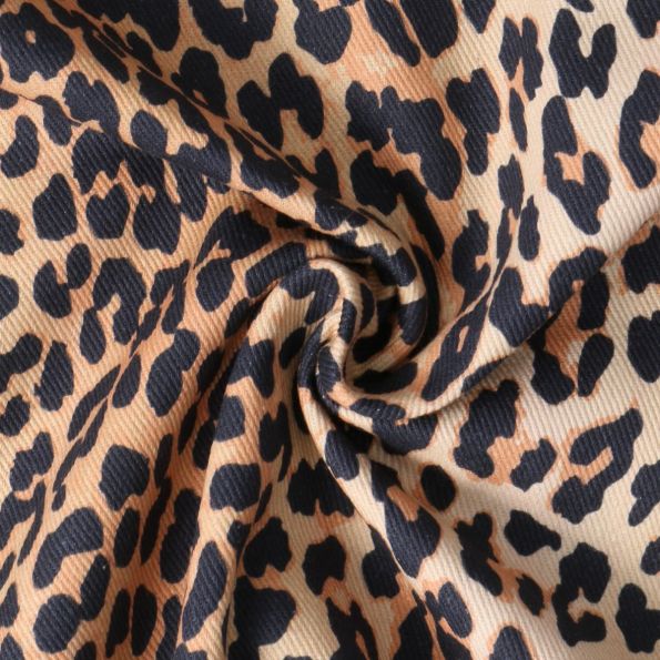 Tissu Toile Canvas Savane Chic motif léopard Noir sur fond Beige sable - Par 10 cm