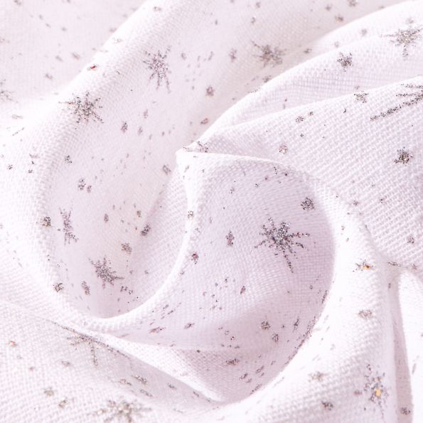 Tissu Toile de jute Etoiles pailletés argentés sur fond Blanc - Par 10 cm