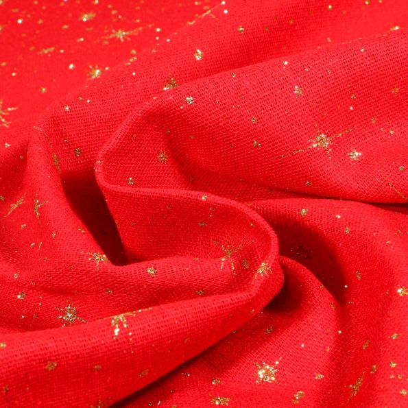 Tissu Toile de jute Etoiles scintillantes dorés sur fond Rouge - Par 10 cm