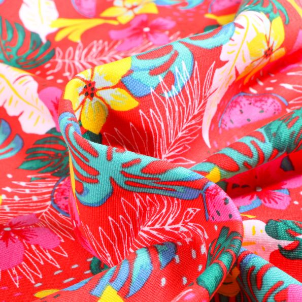 Tissu Jersey Coton Fruits et fleurs tropicales sur fond Rouge - Par 10 cm