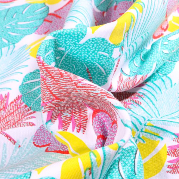 Tissu Jersey Coton Feuilles tropicales multicolores sur fond Blanc - Par 10 cm