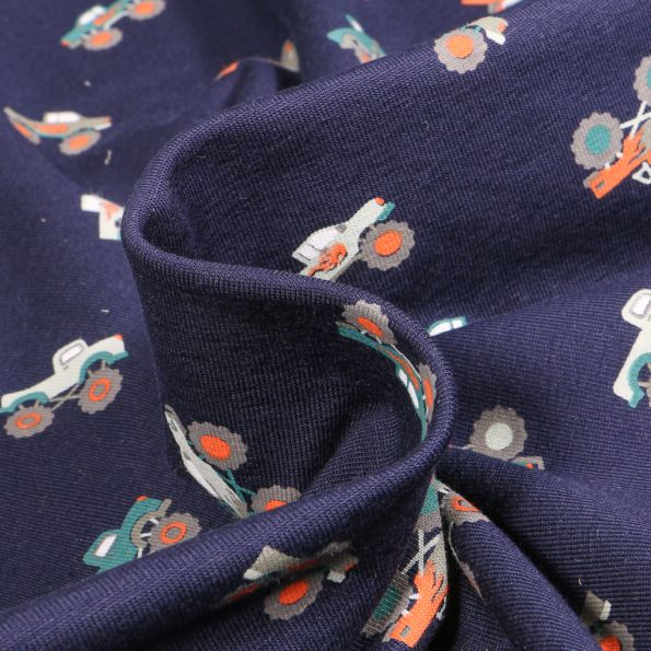 Tissu Jersey Coton Monster truck sur fond Bleu marine - Par 10 cm