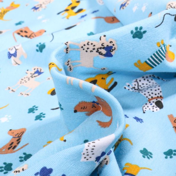 Tissu Jersey Coton Promenade chiens sur fond Bleu ciel - Par 10 cm