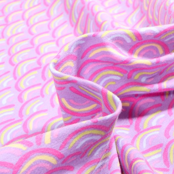 Tissu Jersey Coton Rainbow néon sur fond Lilas - Par 10 cm