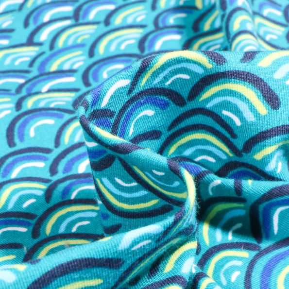 Tissu Jersey Coton Rainbow néon sur fond Bleu turquoise - Par 10 cm