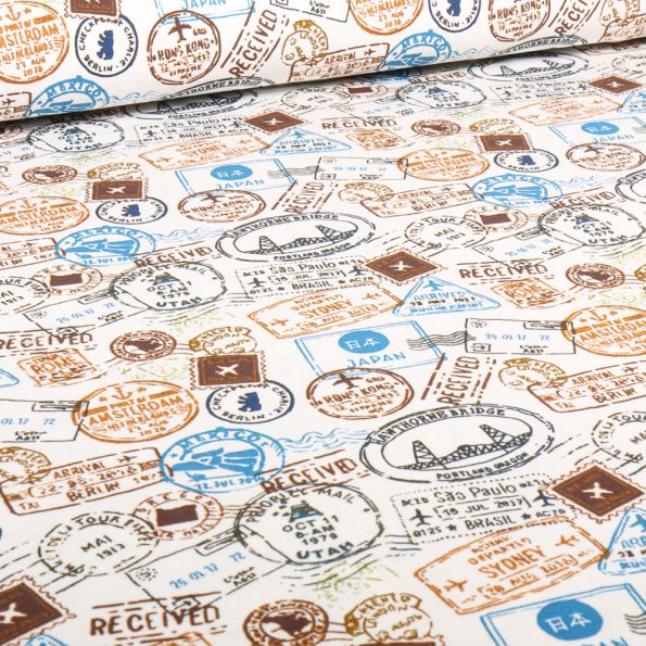 Tissu Jersey Coton Tampons Voyages bleu sur fond Ecru - Par 10 cm