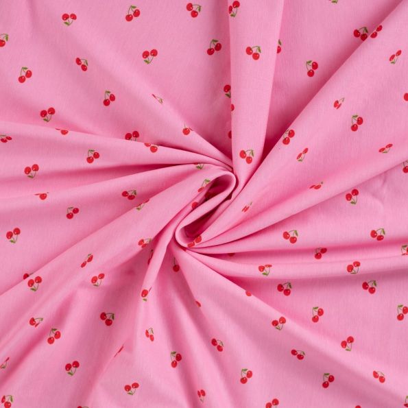 Tissu Jersey Coton imprimé Cerises rouges sur fond Rose - Par 10 cm