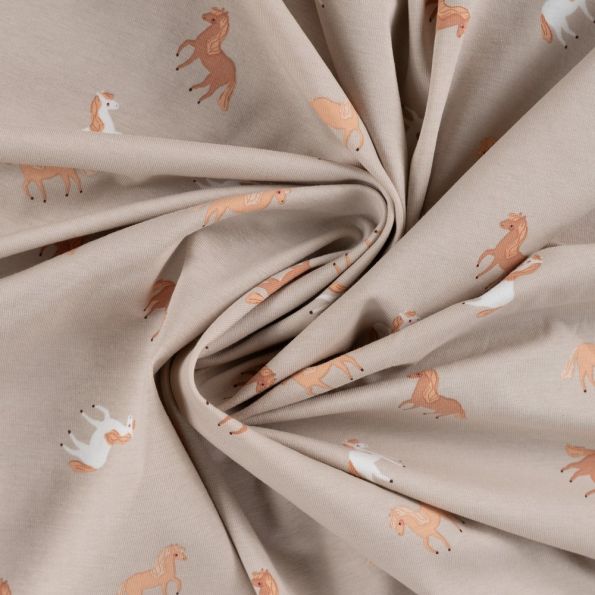 Tissu Jersey Coton imprimé Sacha petits chevaux sur fond Beige - Par 10 cm
