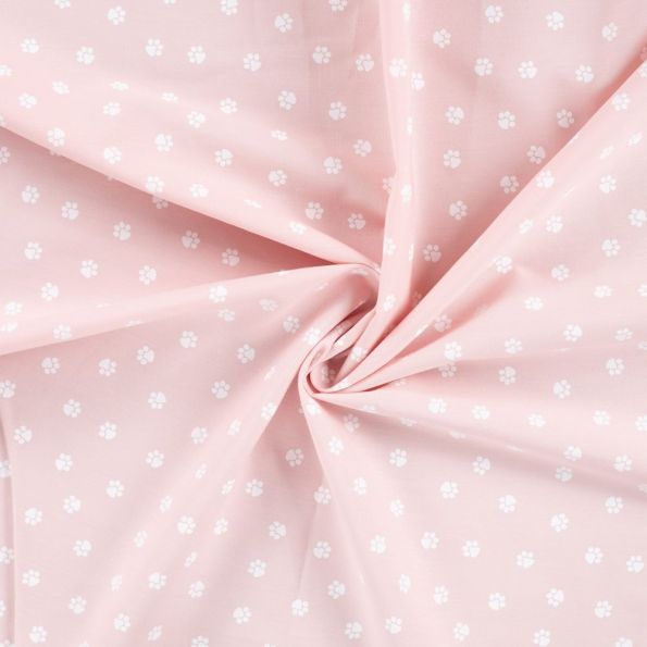 Tissu Popeline de Coton  patounes blanches Zumi sur fond Rose clair - Par 10 cm