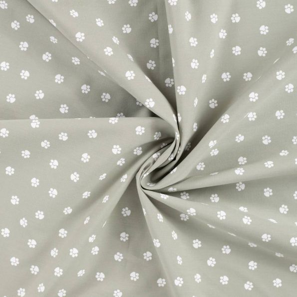 Tissu Popeline de Coton  patounes blanches  Zumi sur fond Vert kaki clair - Par 10 cm