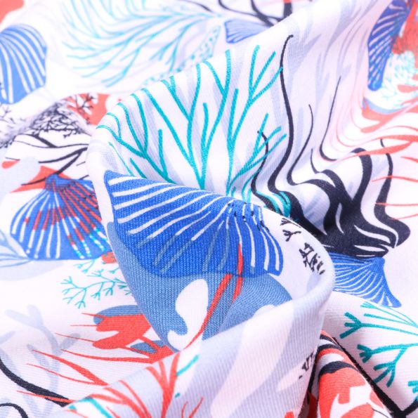 Tissu Sweat léger envers gratté Coraux et coquillages sur fond Blanc - Par 10 cm