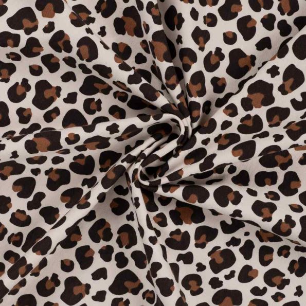 Tissu Jersey stretch Félina sur fond Beige clair - Par 10 cm