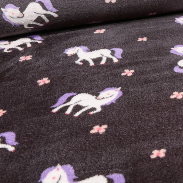 Tissu Doudou double face Pony sur fond Noir - Par 10 cm