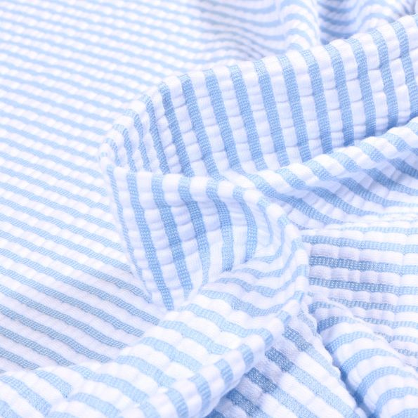 Tissu Seersucker Stretch Rayé sur fond Bleu ciel - Par 10 cm