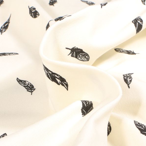 Tissu Jersey Coton Plumes noires sur fond Ecru - Par 10 cm