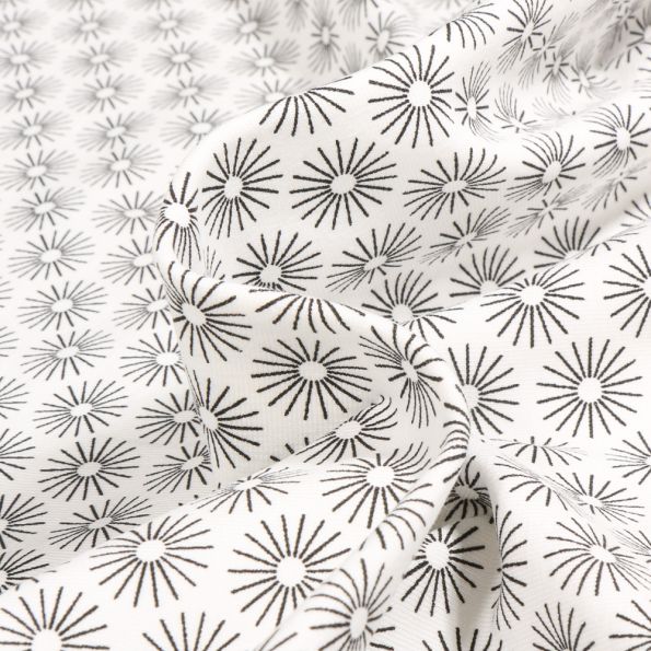 Tissu Jersey Coton Camille soleils noirs sur fond Blanc - Par 10 cm
