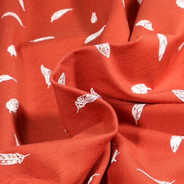 Tissu Jersey Coton Camille Plumes blanches sur fond Brique - Par 10 cm