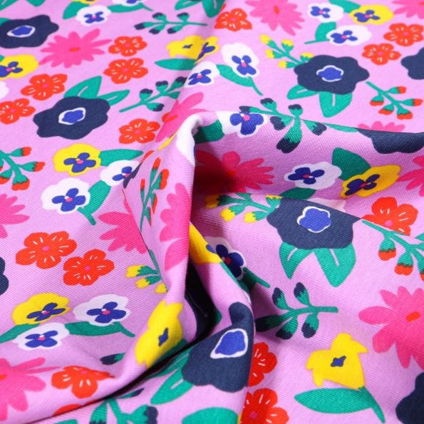Tissu Jersey Coton Fleurs seventies vitaminés sur fond Rose pâle - Par 10 cm