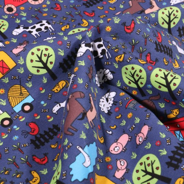 Tissu Jersey Coton Animaux à la ferme sur fond Bleu - Par 10 cm