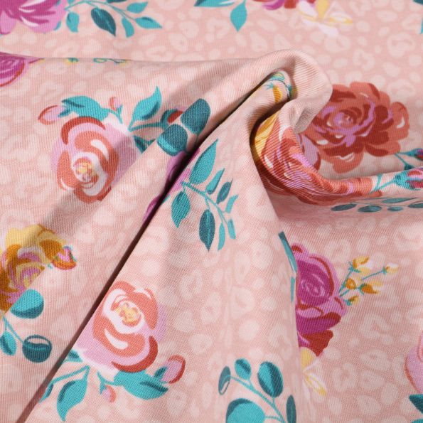Tissu Jersey Coton Tâches léopard et fleurs colorées sur fond Rose pâle - Par 10 cm