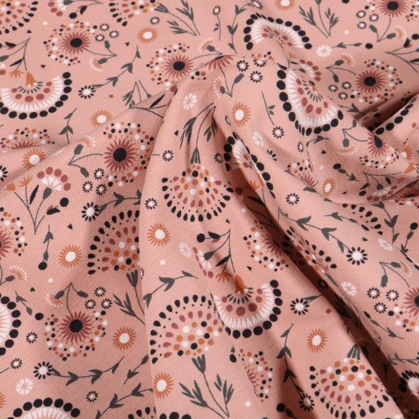 Tissu Jersey Coton Pissenlit stylisé sur fond Rose saumon - Par 10 cm
