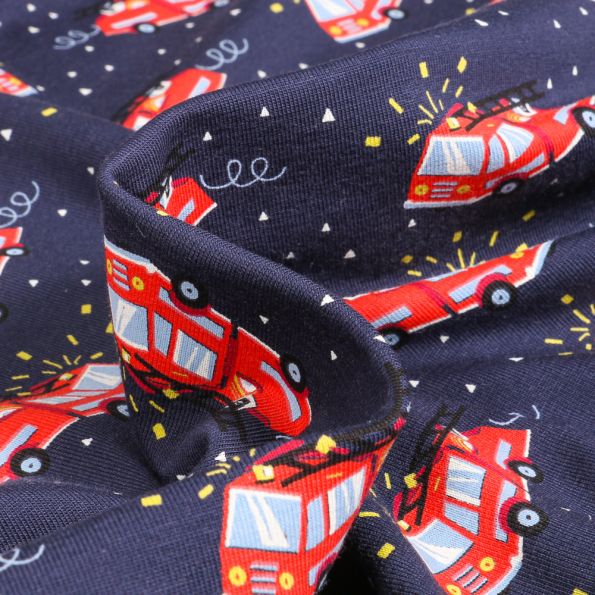Tissu Jersey Coton Camion de pompier en alerte sur fond Bleu marine - Par 10 cm