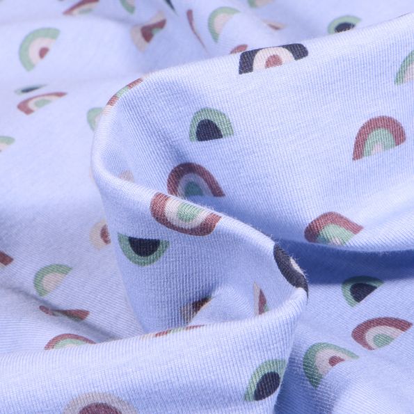 Tissu Jersey Coton Rainbow sur fond Bleu ciel - Par 10 cm