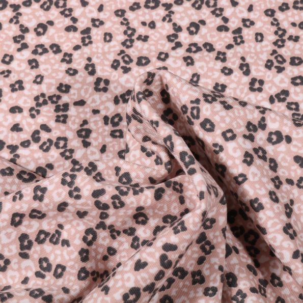 Tissu Jersey Coton Bio Tâches léopard sur fond Rose - Par 10 cm
