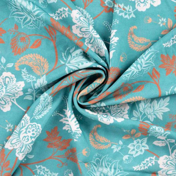Tissu voile Ibiza Fleuris sur fond Bleu turquoise - Par 10 cm