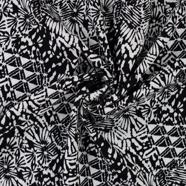 Tissu Viscose imprimé Motifs blancs destructurés sur fond Noir - Par 10 cm