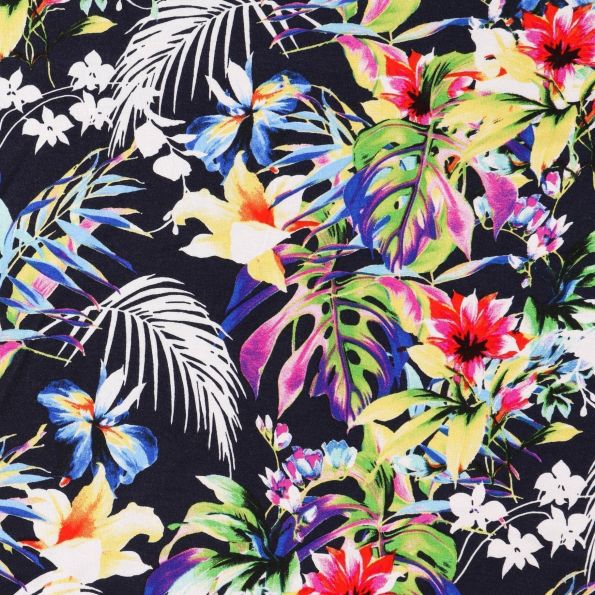 Tissu Jersey Viscose Feuilles de palmiers et fleurs multicolores sur fond Bleu marine - Par 10 cm