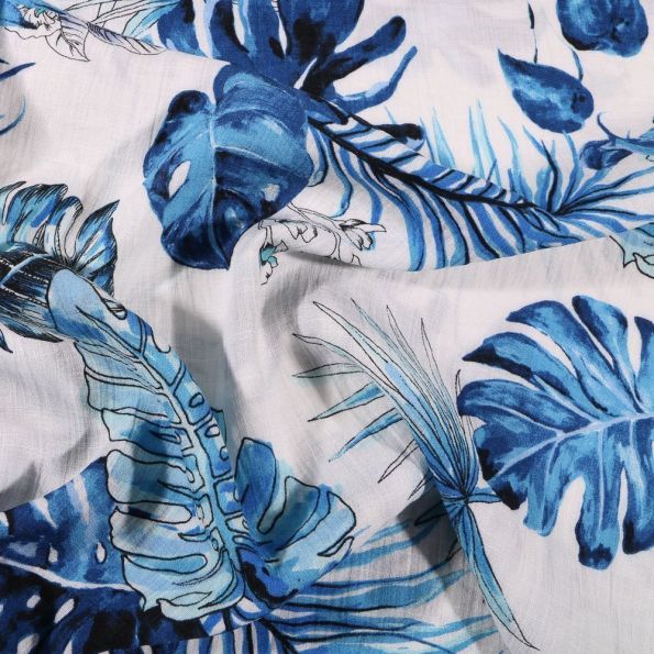 Tissu Viscose texturé Feuilles de palme bleu sur fond Blanc - Par 10 cm