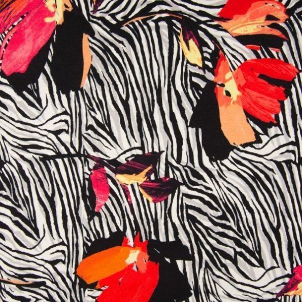 Tissu Jersey viscose imprimé zébré Fleurs jaunes, rouges et orange sur fond Blanc - Par 10 cm