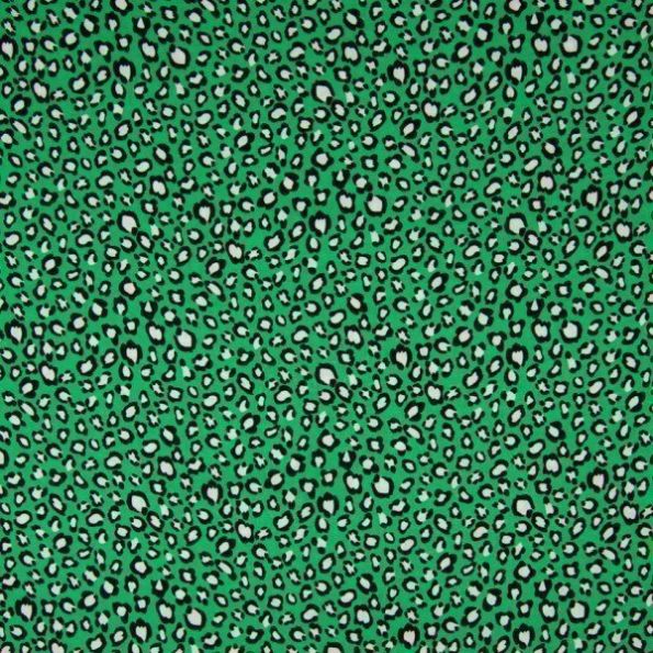 Tissu Viscose imprimé  Taches léopard noires et blanches sur fond Vert gazon - Par 10 cm
