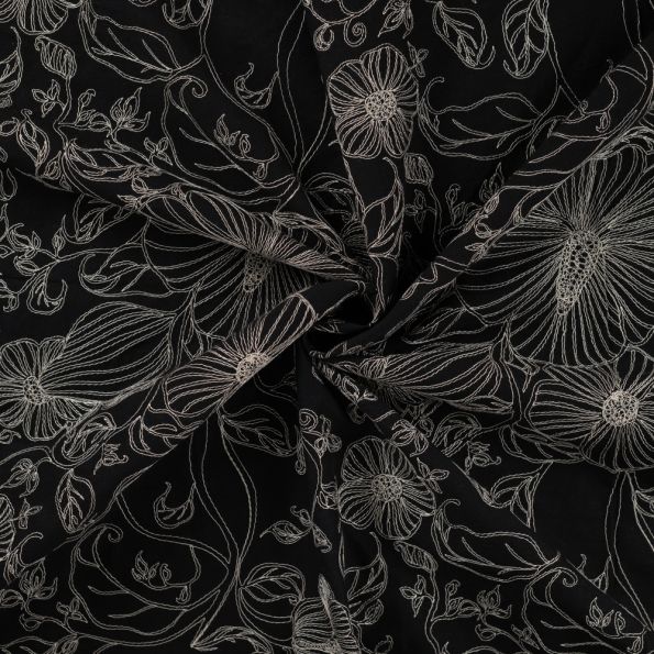 Tissu Coton brodé imprimé Fleuris sur fond Noir - Par 10 cm
