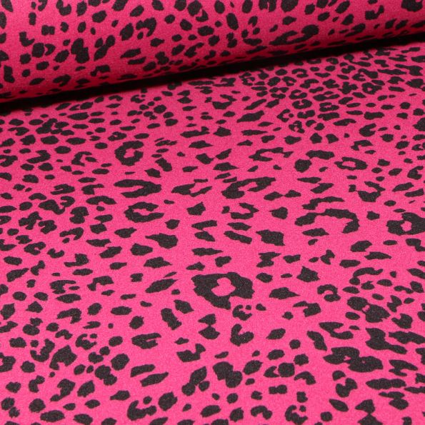 Tissu Drap de manteau léopard sur fond fuschia - Par 10 cm