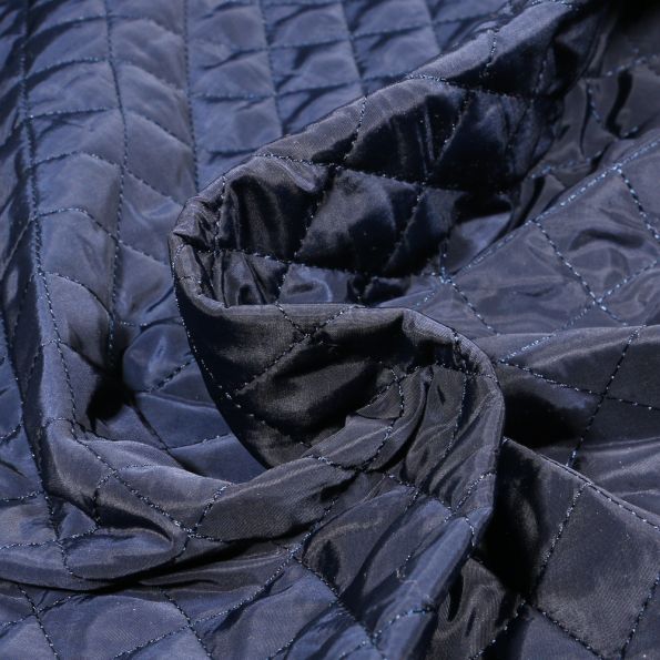 Tissu Doudoune matelassé Dahli sur fond Bleu marine - Par 10 cm