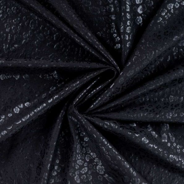 Tissu Simili cuir Naya extensible effet panthère brillant sur fond Noir - Par 10 cm