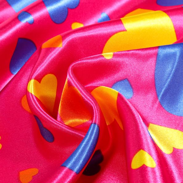 Tissu Satin Coeurs multicolores sur fond Rose - Par 10 cm