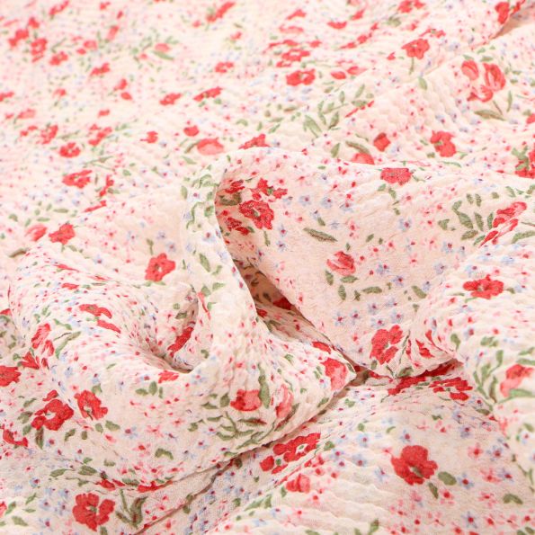 Tissu Mousseline gaufré Fleurs vintage sur fond Beige clair - Par 10 cm