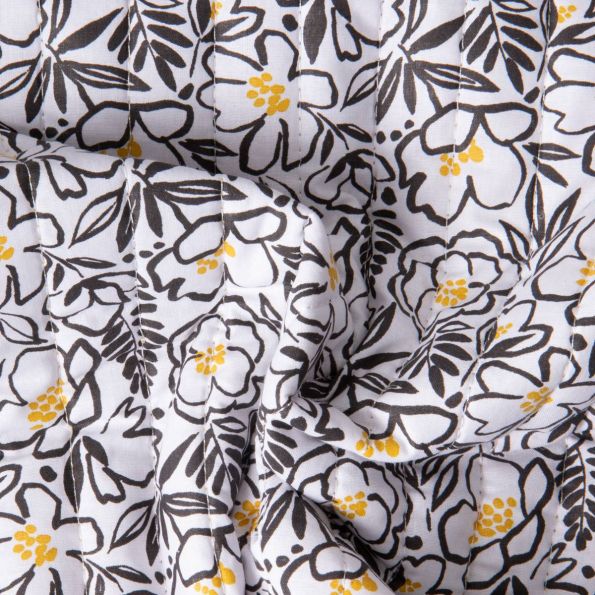 Tissu Coton Matelassé réversible Ray floral Noir et feuillage Jaune sur fond Blanc - Par 10 cm